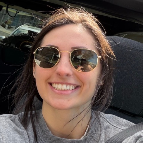 Peyton Robertson smiling in sunglasses
